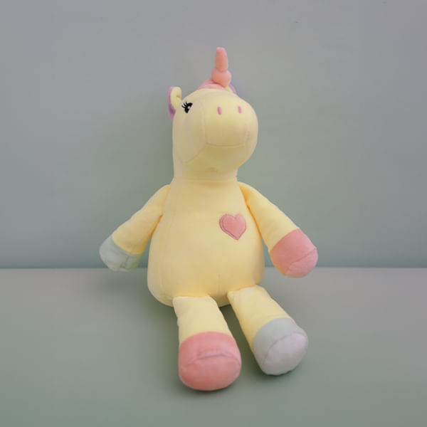 Peluche Unicornio Amarillo En Una Posicion Sentada De 23 Cm